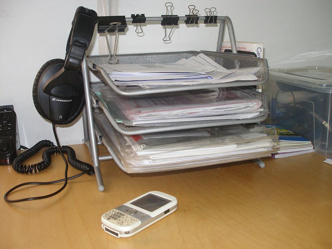 Inbox trays on a desk.