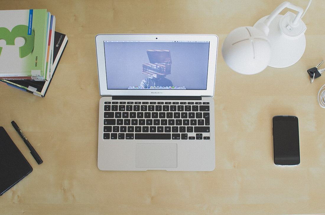 A laptop on a desk.