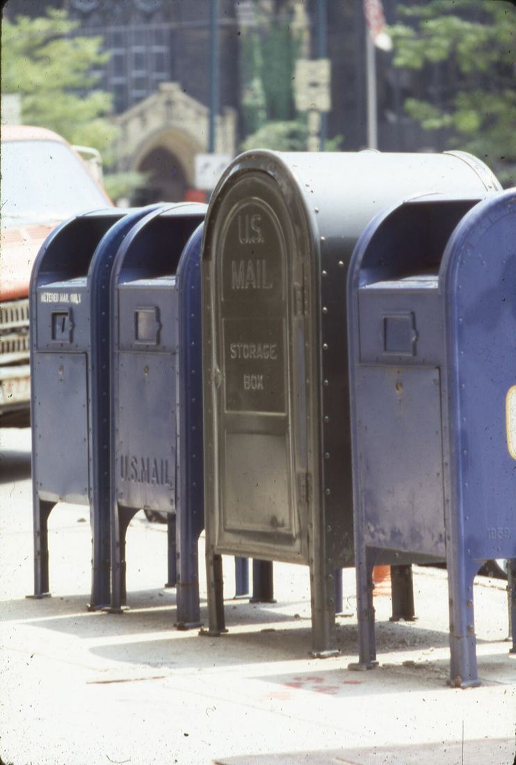 Mailboxes on a downtown street corner.